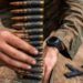 A U.S. Marine with Weapons Company, 1st Battalion, 5th Marine Regiment, Marine Rotational Force – Darwin 26, prepares 7.62 mm ammunition before a reaction-to-contact live-fire range